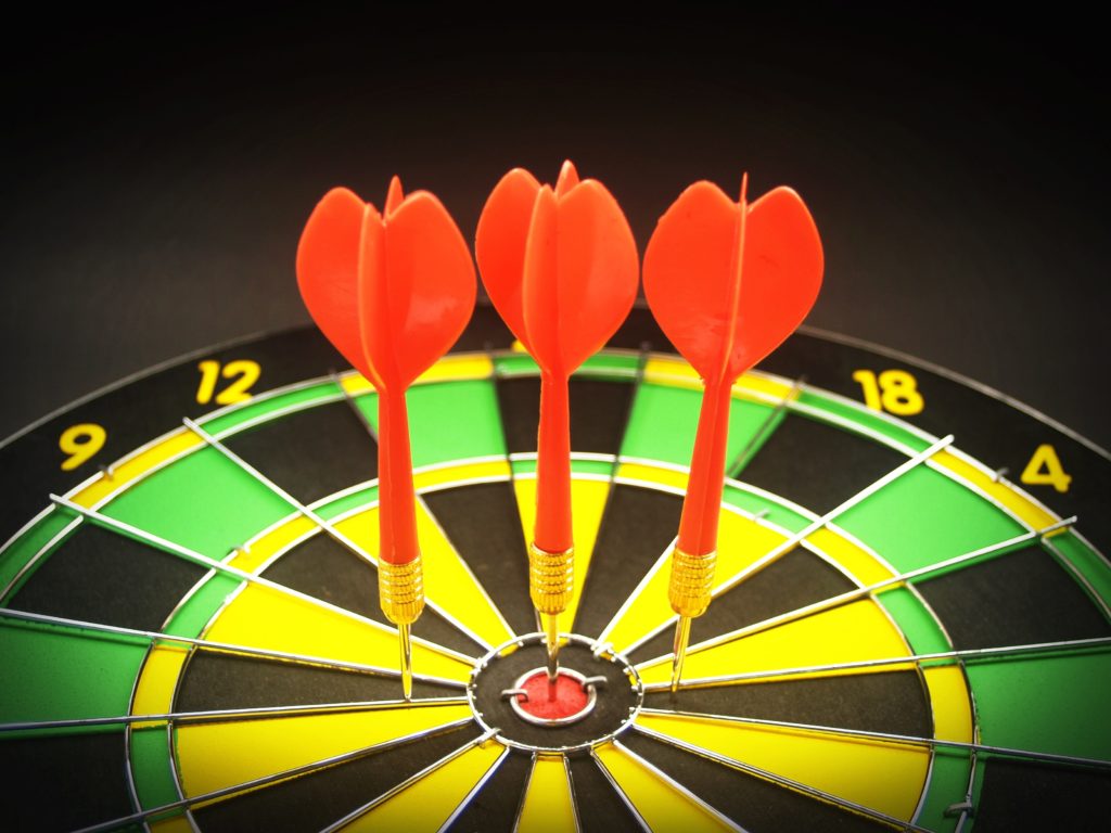 Picture of darts on dartboard symbolizing objectives.