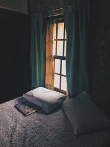 Picture of a bedroom with blackout curtains.