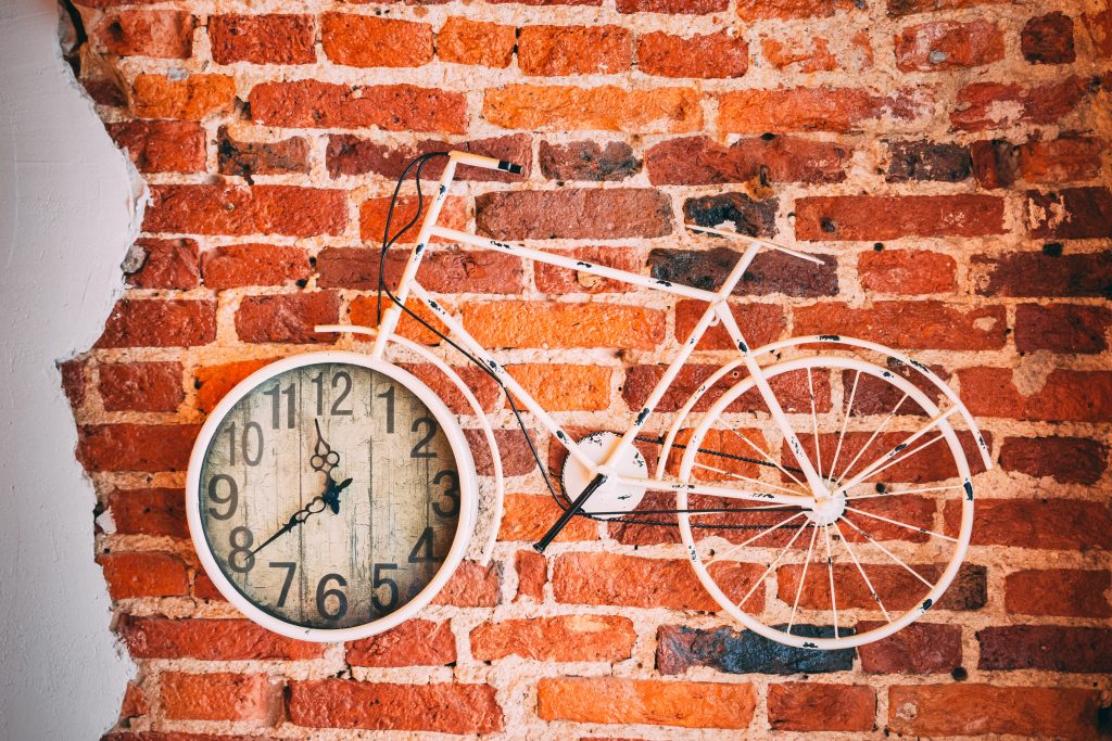 Picture of a bike with a clock embedded in the front wheel.